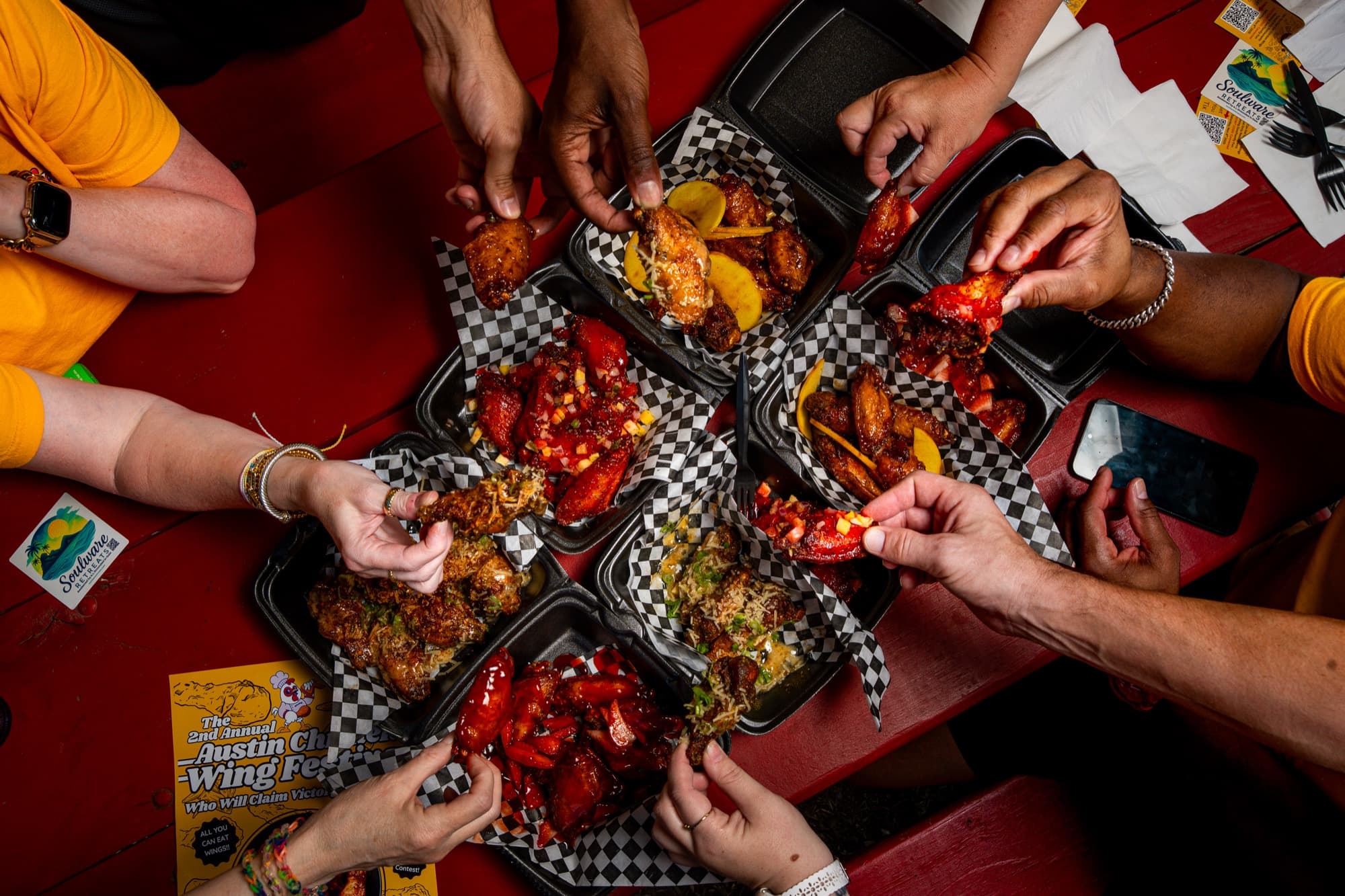 Austin wing festival vendors setting up their booths with delicious wings