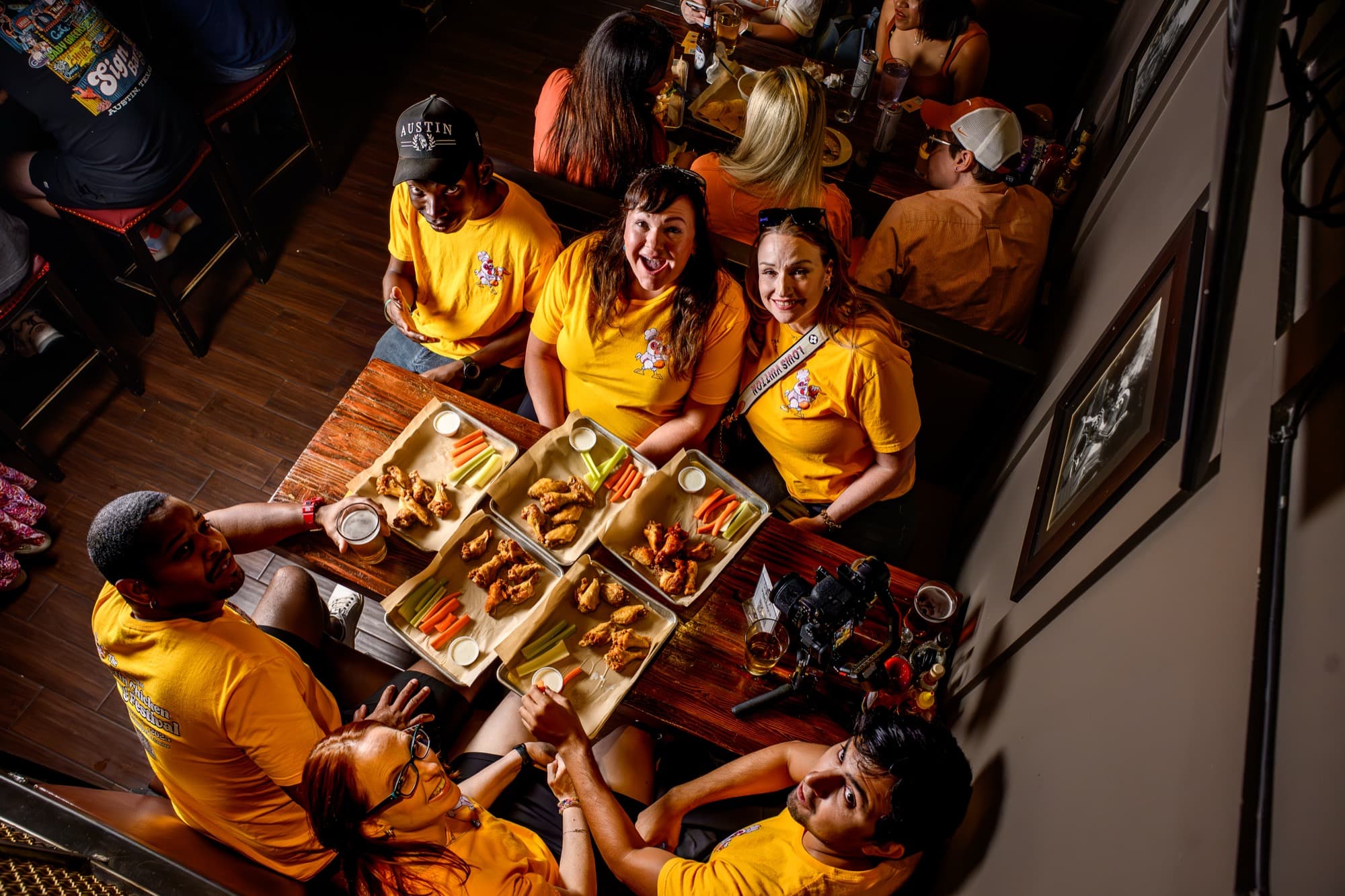 Austin wing festival volunteers in yellow shirts serving delicious wings